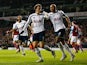 Vlad Chiriches of Spurs (6) celebrates with team mate Younes Kaboul as he scores their third goal during the FA Cup Third Round Replay match between Tottenham Hotspur and Burnley at White Hart Lane on January 14, 2015
