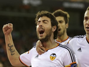 Valencia score three to see off Malaga