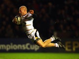 Joe Simpson of Wasps dives into score the second try during the European Rugby Champions Cup match between Harlequins and Wasps at Twickenham Stoop on January 17, 2015