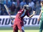 West Indies batsman Andre Russell (L) celebrates after the West Indies won the match by one wicket during the 4th One Day International cricket match on January 25, 2015