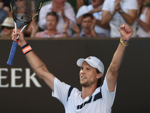 Italy's Andreas Seppi celebrates after victory in his men's singles match against Switzerland's Roger Federer on day five of the 2015 Australian Open tennis tournament in Melbourne on January 23, 2015