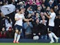 Andros Townsend (L) of Spurs is congratulated by teammate Paulinho of Spurs after scoring the opening goal from the penalty spot during the FA Cup Fourth Round match against Leicester City on January 24, 2015