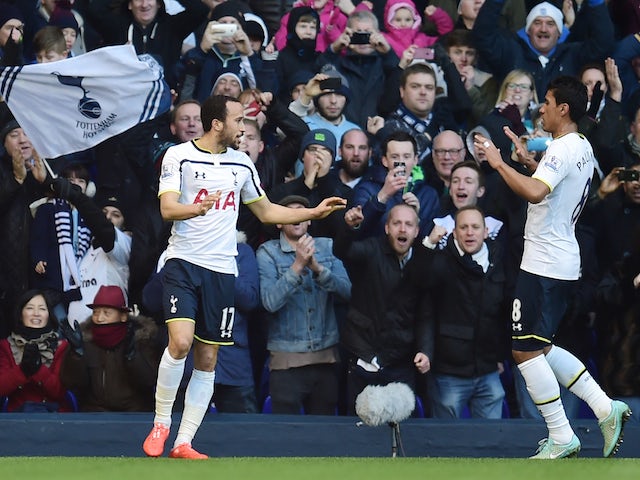 Andros Townsend (L) of Spurs is congratulated by teammate Paulinho of Spurs after scoring the opening goal from the penalty spot during the FA Cup Fourth Round match against Leicester City on January 24, 2015