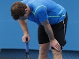 Andy Murray holds his knee during a practice session at the Australian Open on January 20, 2015