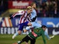 Atletico Madrid's French forward Antoine Griezmann jumps over Rayo Vallecano's goalkeeper Tono Rodriguez after scoring during the Spanish League football match Atletico de Madrid vs Rayo Vallecano at Vicente Calderon stadium in Madrid on January 24, 2015