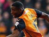 Benik Afobe of Wolverhampton Wanderers beats the challenge from Andre Bikey of Charlton Athletic during the Sky Bet Championship match on January 24, 2015