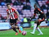 Billy Jones of Sunderland is closed down by Seko Fofana of Fulham during the FA Cup Fourth Round match between Sunderland and Fulham at Stadium of Light on January 24, 2015