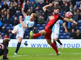 Chris Taylor of Blackburn Rovers shoots past Jordi Amat of Swansea City to score their first and equalising goal during the FA Cup Fourth Round match between Blackburn Rovers and Swansea City at Ewood park on January 24, 2015