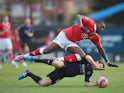 Jay Emmanuel-Thomas of Bristol City is tackled by Mark Noble of West Ham United during the FA Cup Fourth Round match between Bristol City and West Ham United at Ashton Gate on January 25, 2015 
