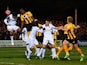 Tom Elliott of Cambridge United heads towards goal under pressure from Marouane Fellaini of Manchester United during the FA Cup Fourth Round match between Cambridge United and Manchester United at The R Costings Abbey Stadium on January 23, 2015