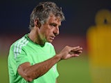 Algeria's coach Christian Gourcuff speaks to his team during a training session at Mongomo stadium on January 18, 2015