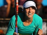 A happy Christina McHale celebrates winning her first-round match of the Australian Open despite vomiting on court on January 19, 2015