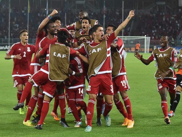 Equatorial Guinea's players celebrate after scoring a goal during the 2015 African Cup of Nations group A football match between Gabon and Equatorial Guinea, on January 25, 2015