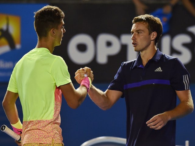 Ernests Gulbis congratulates Thanasi Kokkinakis after the Australian's triumph in the first round of the Australian Open on January 19, 2015