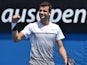 Grigor Dimitrov celebrates at the end of his first-round match on day one of the Australian Open on January 19, 2015