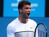Grigor Dimitrov celebrates at the end of his second-round match on day three of the Australian Open on January 21, 2015