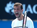 Grigor Dimitrov of Bulgaria celebrates winning his third round match against Marcos Baghdatis of Cyprus during day five of the 2015 Australian Open at Melbourne Park on January 23, 2015