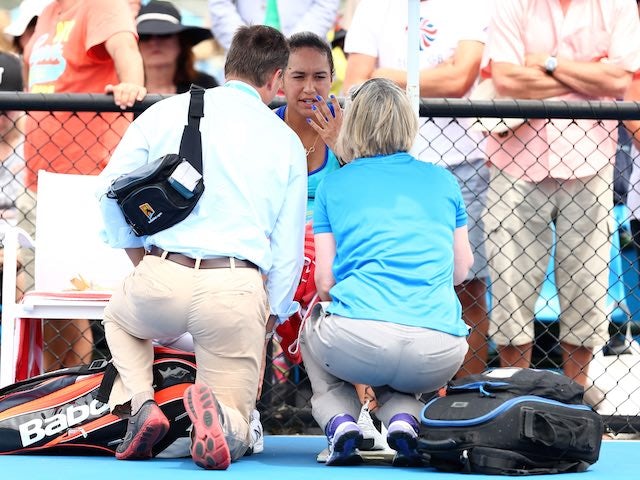 Heather Watson is attended to by staff on day two of the Australian Open on January 20, 2015