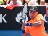 Australia's James Duckworth plays a shot during his men's singles match against France's Richard Gasquet on day three of the 2015 Australian Open tennis tournament in Melbourne on January 21, 2015