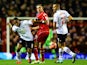 Jordan Henderson of Liverpool battles for the ball with Neil Danns and Darren Pratley of Bolton Wanderers during the FA Cup Fourth Round match on January 24, 2015