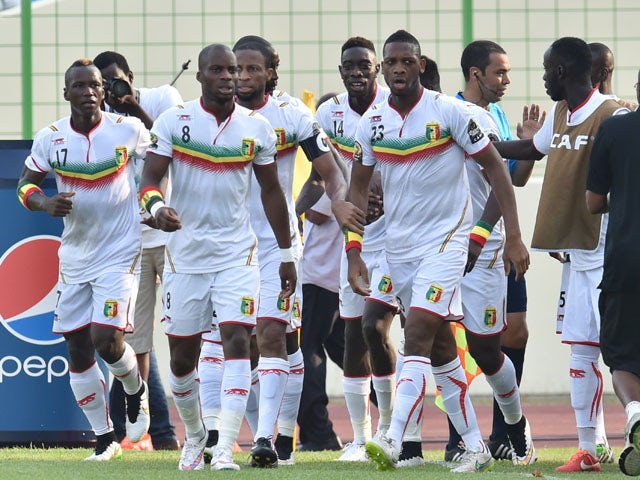 Mali's players celebrate after scoring a goal during the 2015 African Cup of Nations group D football match between Ivory Coast and Mali in Malabo on January 24, 2015