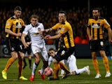 James Wilson of Manchester United battles for the ball with Josh Coulson of Cambridge United during the FA Cup Fourth Round match between Cambridge United and Manchester United at The R Costings Abbey Stadium on January 23, 2015