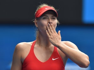 Sharapova through safely at French Open