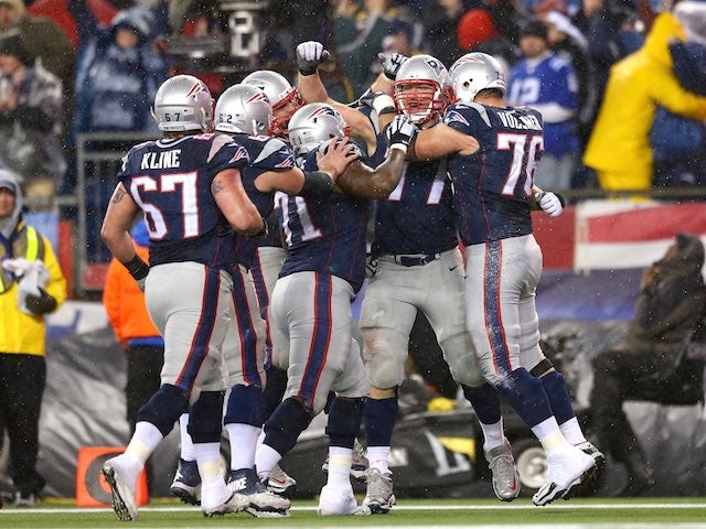 Nate Solder of the New England Patriots celebrates with teammates during the AFC Championship game on January 18, 2015