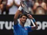 Novak Djokovic smiles to the crowd after his first-round win at the Australian Open on January 20, 2015