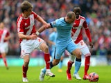 Pablo Zabaleta of Manchester City battles for the ball with Patrick Bamford and Albert Adomah of Middlesbrough during the FA Cup Fourth Round match on January 24, 2015