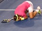 Rafael Nadal collapses to the ground after triumphing in the second round of the Australian Open on January 21, 2015