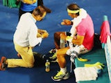 Rafael Nadal receives medical treatment on day three of the Australian Open on January 21, 2015