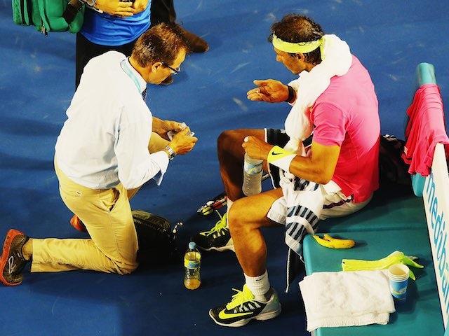 Rafael Nadal receives medical treatment on day three of the Australian Open on January 21, 2015
