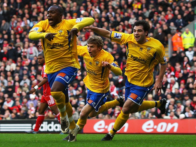 Richard Pacquette of Havant (L) celebrates with team mates his opening goal during the FA Cup 4th round match against Liverpool on January 26, 2008