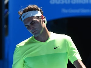 Federer knocked out by Isner