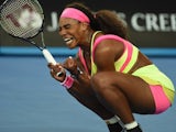 Serena Williams squats with pleasure after winning her first-round encounter at the Australian Open on January 20, 2015