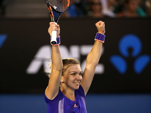 Simona Halep of Romania celebrates winning her fourth round match against Yanina Wickmayer of Belgium during day seven of the 2015 Australian Open at Melbourne Park on January 25, 2015 