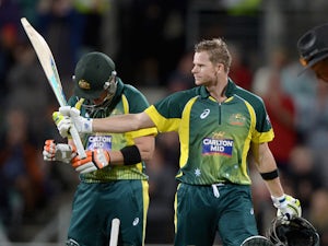 Warner's ton pushes Australia to record total
