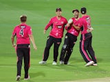 Sixers players celebrate with teammate Ryan Carters after he took a catch to dismiss Johan Botha of the Adelaide Strikers during the Big Bash League Semi FInal match between the Adelaide Strikers and the Sydney Sixers at Adelaide Oval on January 24, 2015