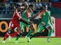 Congo's forward Thierry Bifouma (L) challenges Burkina Faso's defender Steeve Yago and Burkina Faso's defender Mohamed Koffi (R) during the 2015 African Cup of Nations match on January 25, 2015