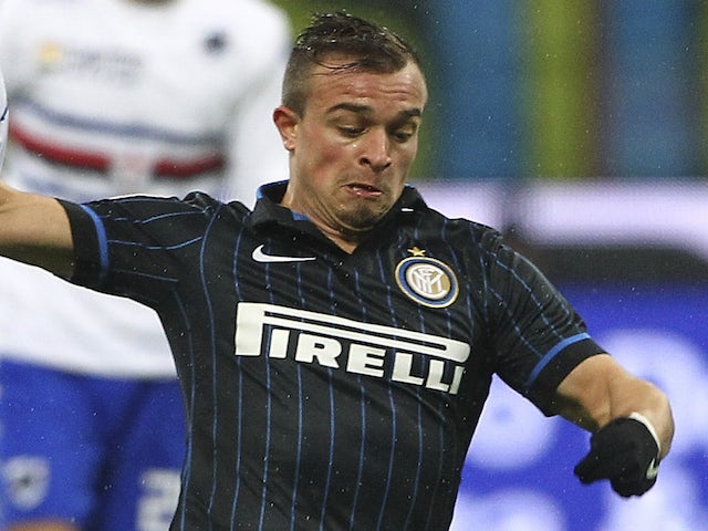 Xherdan Shaqiri (R) of FC Internazionale Milano competes for the ball with Nenad Krsticic (L) of UC Sampdoria during the TIM Cup match on January 21, 2015
