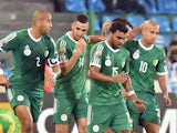 Algerian players celebrate after scoring a goal during the 2015 African Cup of Nations group C football match between Senegal and Algeria, on January 27, 2015
