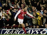  Dennis Bergkamp of Arsenal celebrates by pointing at the photographers after scoring their second goal of the game during the Barclays Premiership match between Arsenal and Manchester United at Highbury on February 1, 2005