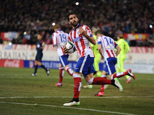 Raul Garcia of Club Atletico de Madrid celebrates after scoring his team's 2nd goal during the Copa del Rey Quarter Final Second Leg match between Club Atletico de Madrid and FC Barcelona at Vicente Calderon Stadium on January 28, 2015