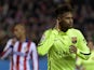 Barcelona's Brazilian forward Neymar celebrates after scoring his second goal during the Spanish Copa del Rey (King's Cup) quarter final second leg football match Club Atletico de Madrid vs FC Barcelona at the Vicente Calderon stadium in Madrid on January