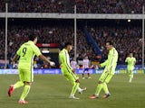 Barcelona's Brazilian forward Neymar celebrates with Barcelona's Argentinian forward Lionel Messi after scoring the equalizer during the Spanish Copa del Rey (King's Cup) quarter final second leg football match Club Atletico de Madrid vs FC Barcelona at t