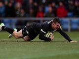 Ben Spencer of Saracens dives over to score a try during the LV= Cup match between London Welsh and Saracens at Kassam Stadium on February 1, 2015