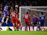 Branislav Ivanovic of Chelsea heads in their first goal in extra time during the Capital One Cup Semi-Final second leg against Liverpool on January 27, 2015