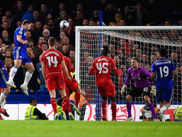 Branislav Ivanovic of Chelsea heads in their first goal in extra time during the Capital One Cup Semi-Final second leg against Liverpool on January 27, 2015