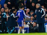 Cesc Fabregas of Chelsea high fives Jose Mourinho manager of Chelsea as he is replaced during the Capital One Cup Semi-Final second leg against Liverpool on January 27, 2015